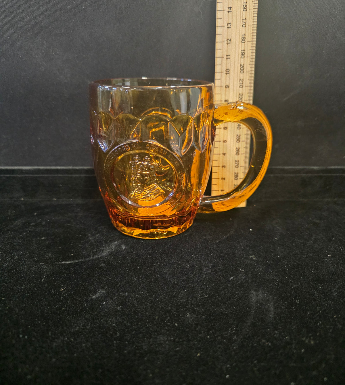 #P021 Vintage Amber Glass Mug Stein – Embossed Baseball Player Design – Approx. 4" Tall